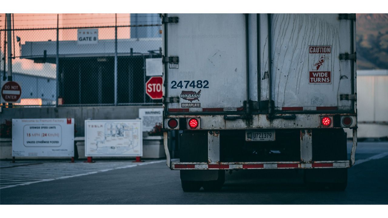 Semi truck trailer on road