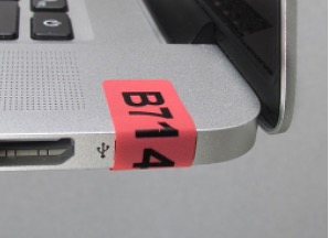 Non-residue label affixed to laptop